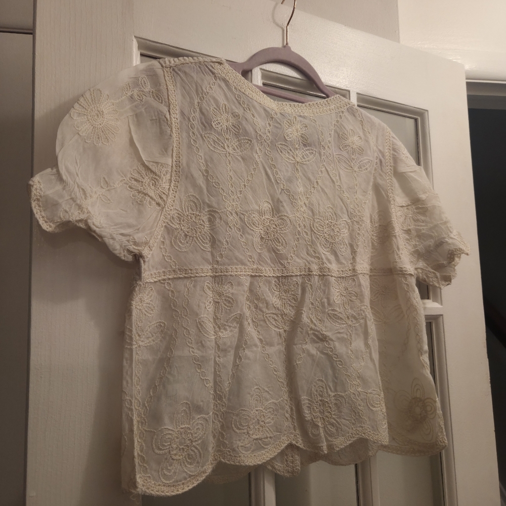 AZ Elegant Crochet Lace Blouse in Cream With Ruffled Sleeves & Fringe - Picture 8 of 10